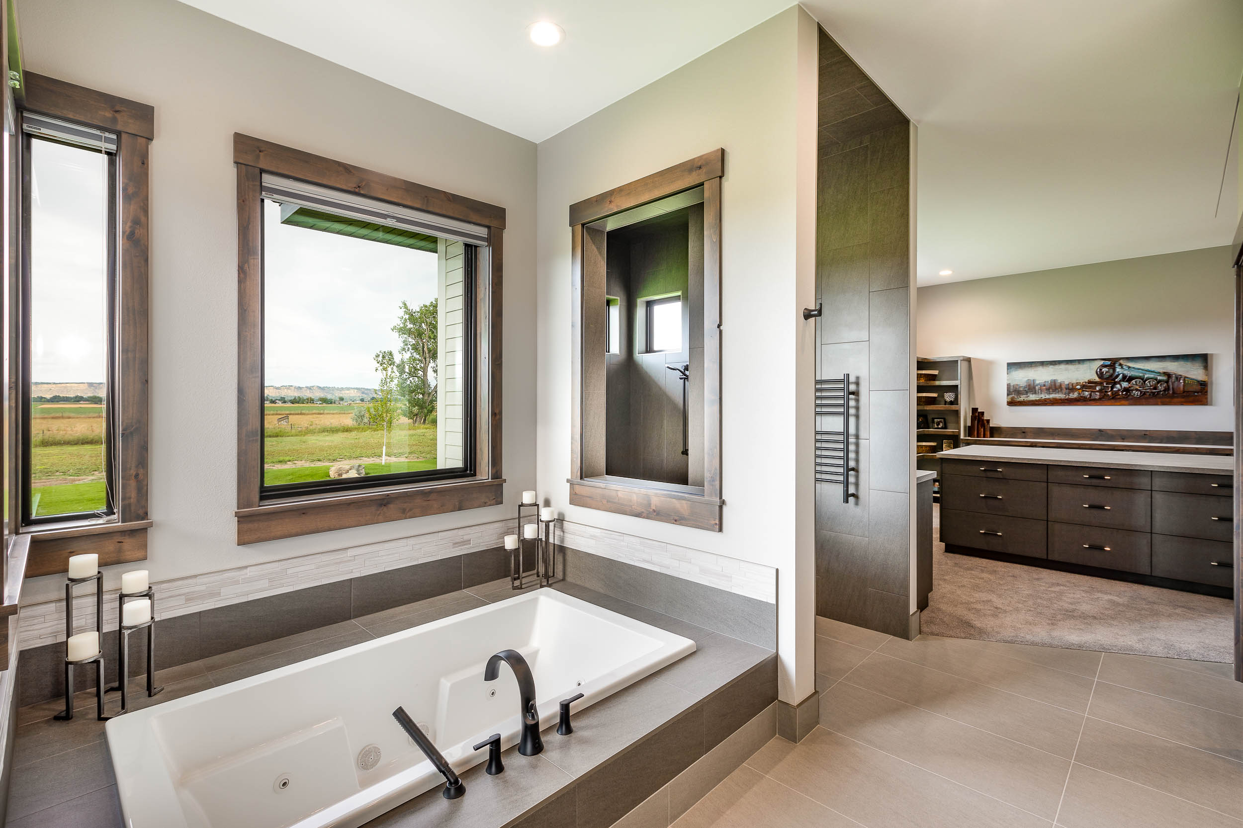 Large master bathroom with soaking tub designed by Ban Construction