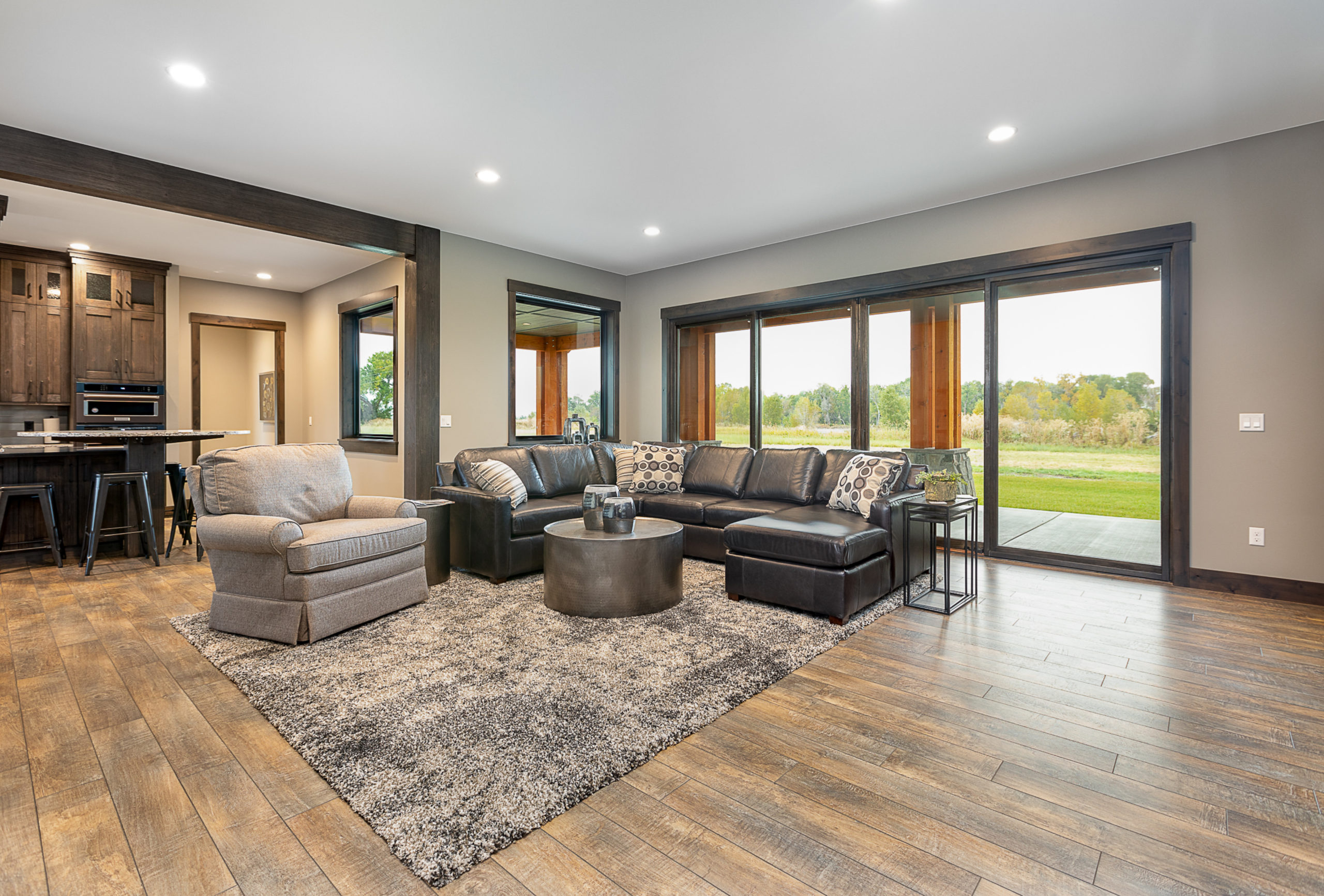 Walkout recreation room with leather couches